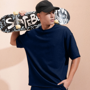 Model wearing navy blue co-ord set for men with skateboard